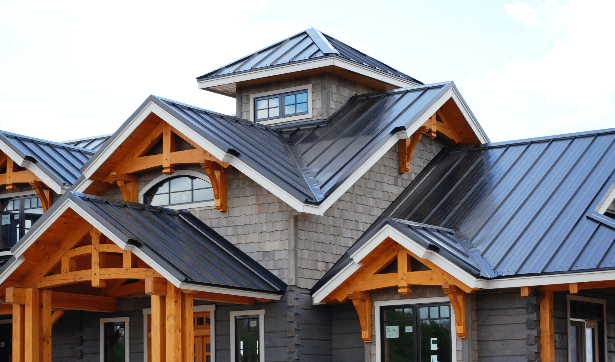 Complex multi-peak standing seam metal roof with timber frame