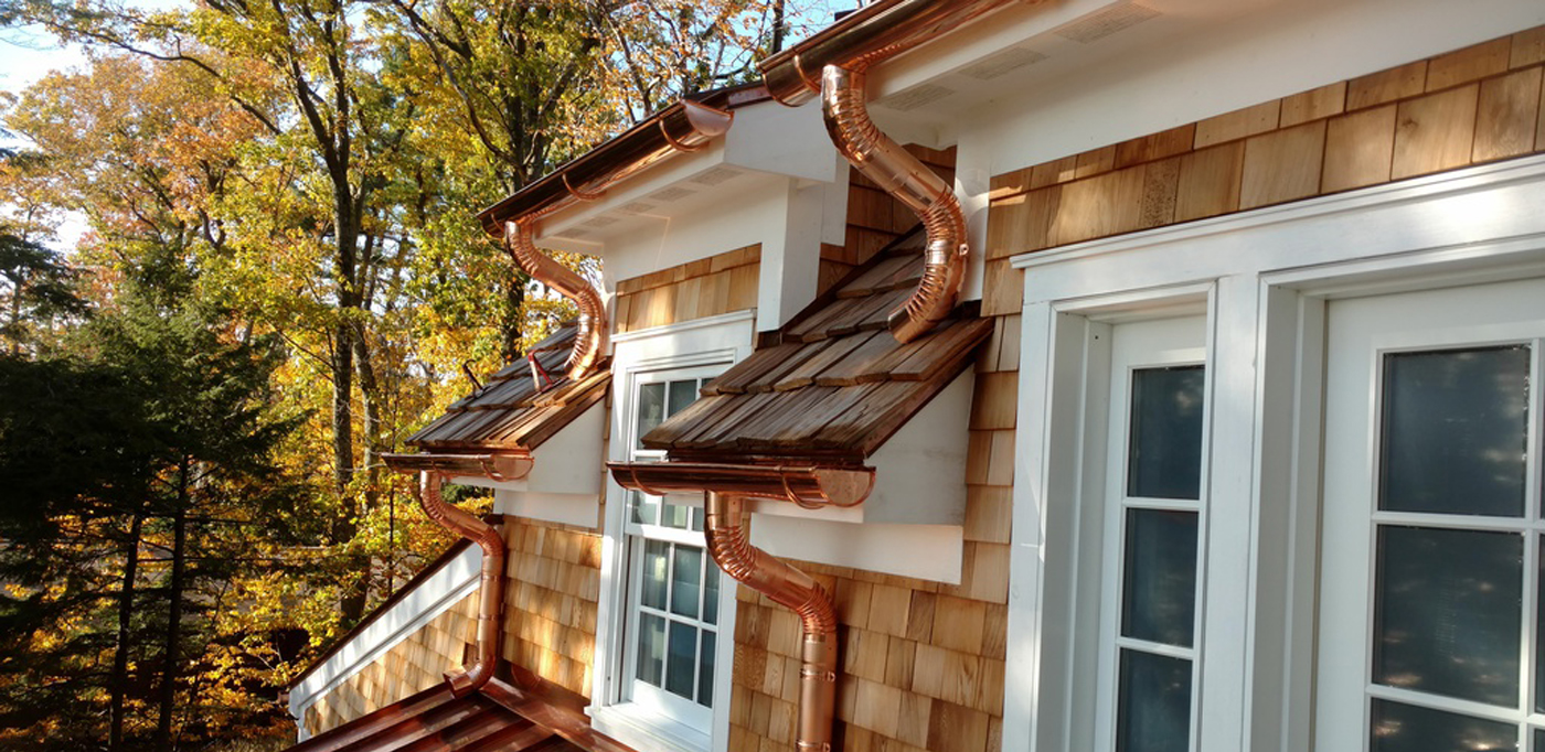 Copper gutters and downspouts