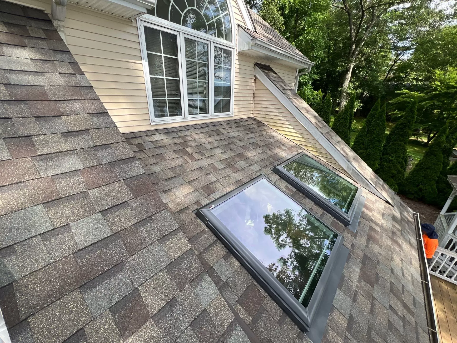 Asphalt shingle roof with skylights